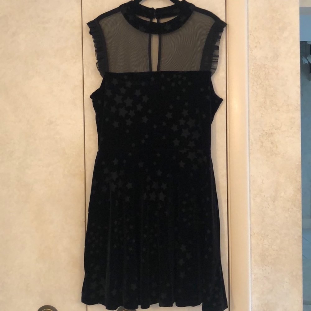 EUC Tweeze Me Black Velvet Dress. Stars. Sheer top. Velvet Neck. Ruffle sleeves.